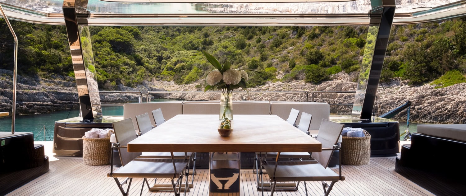 Luxury Yacht Dining Area Elegant yacht dining area with panoramic views and modern design.