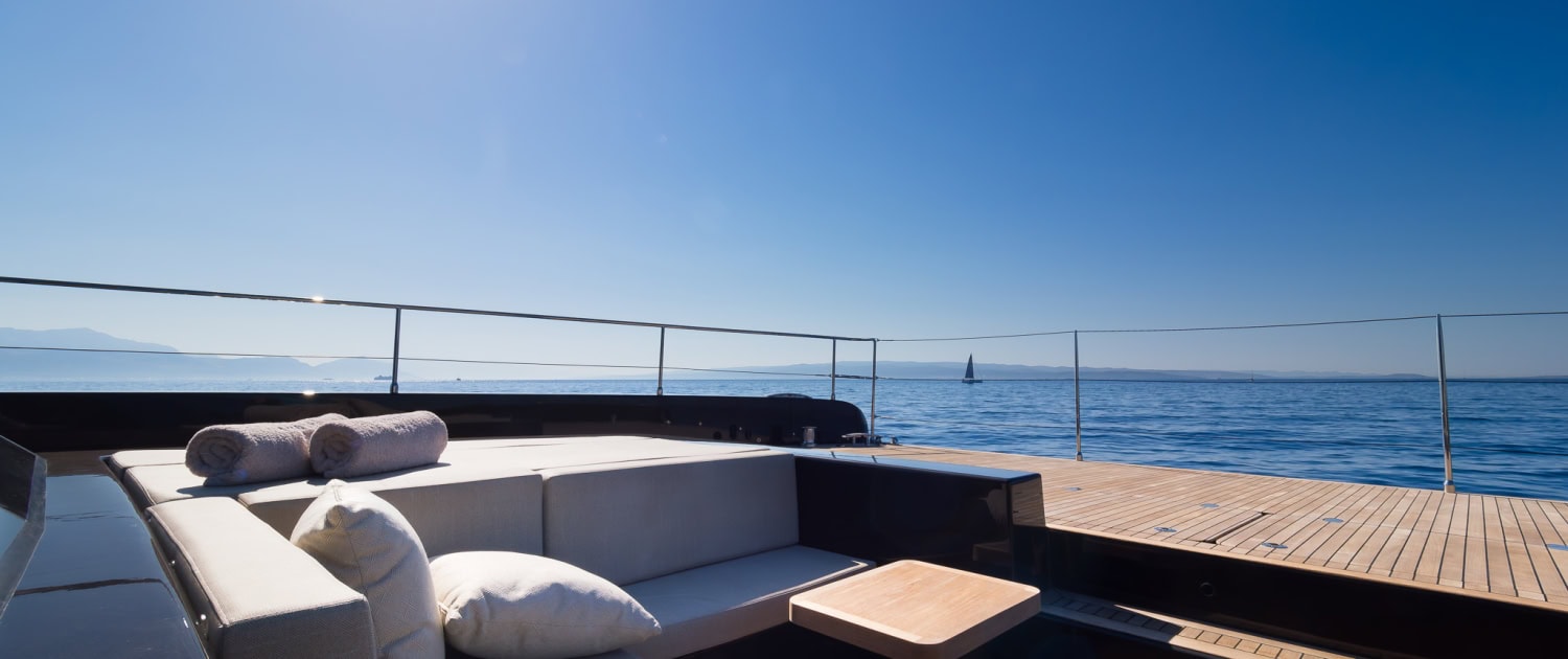 Sunreef Power Deck Lounge Sunreef Power yacht deck with outdoor seating and ocean view.