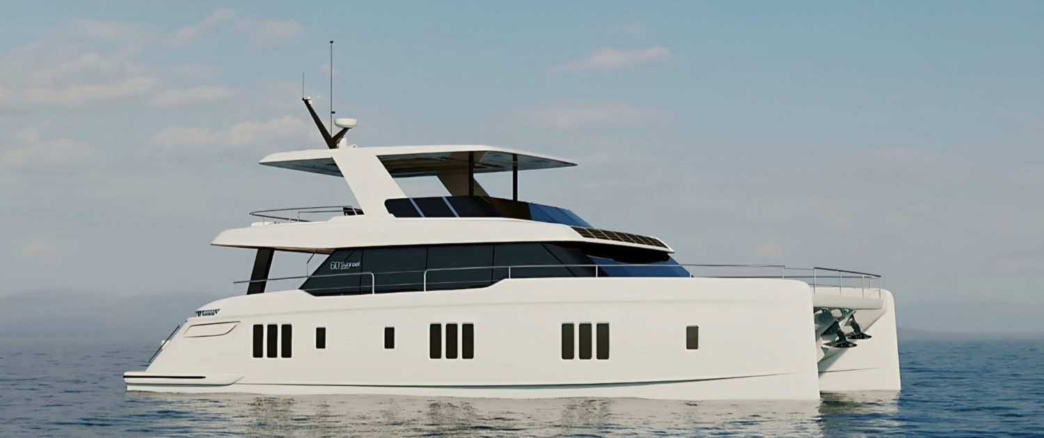 Luxury yacht sailing on calm ocean waters, showcasing the fleet at Ocean Sailing House.